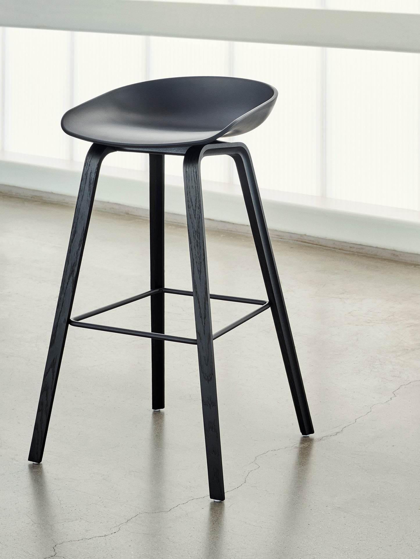 About A Stool AAS 32 by HAY - H 75 cm / Black Shell / Black Lacquered Oak Base