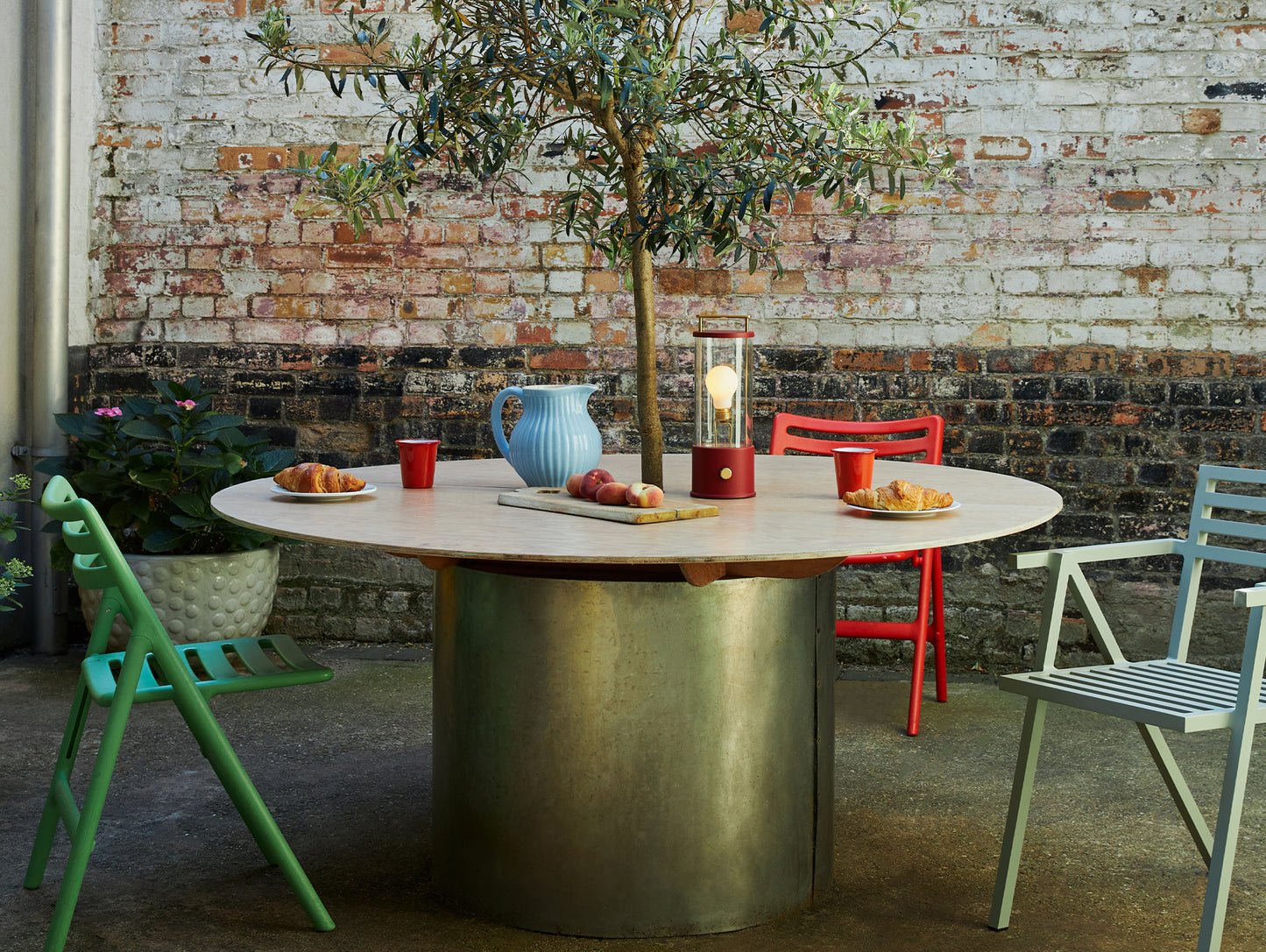 The Muse Portable Lamp in Pomona Red by Tala