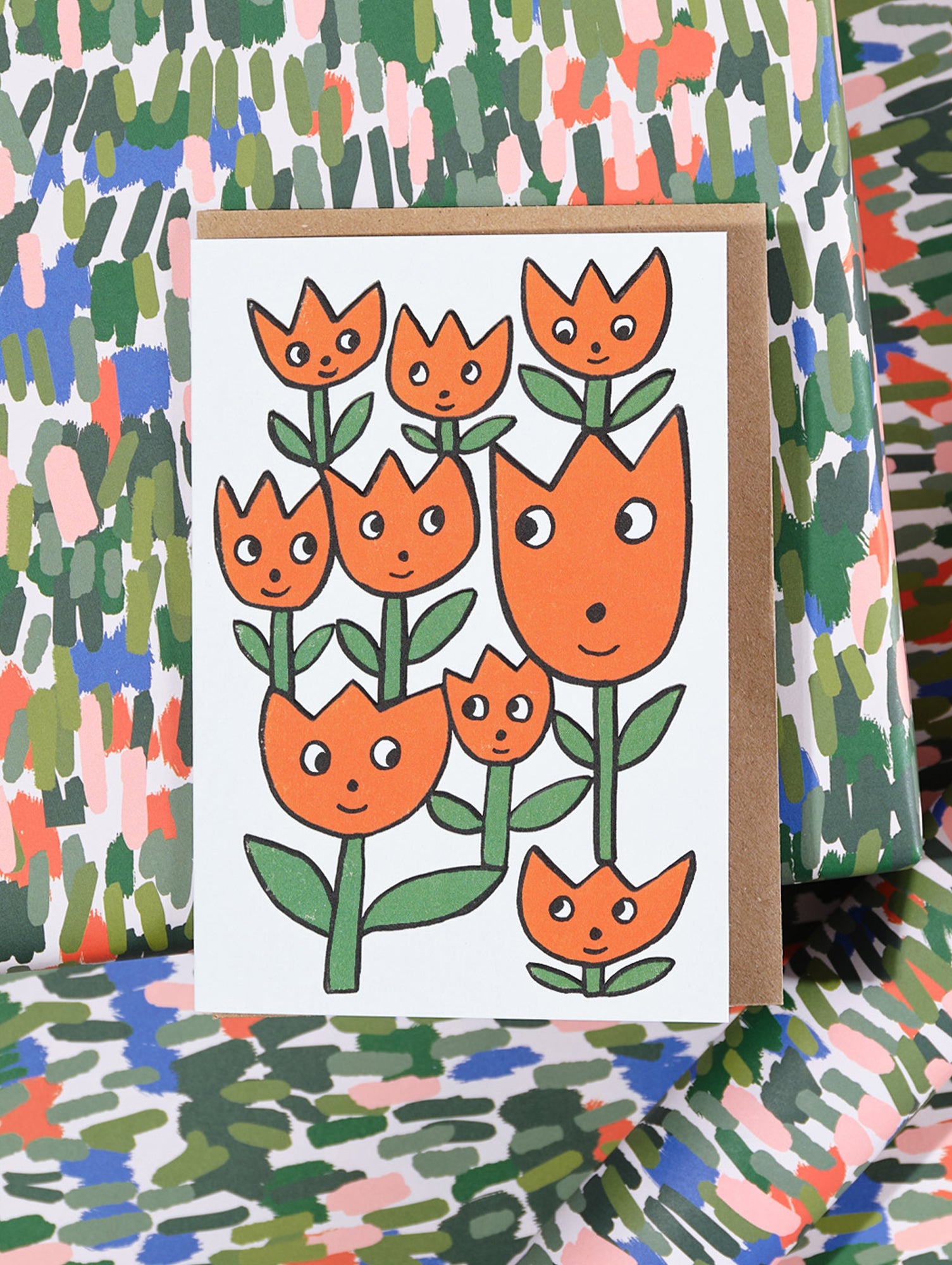'Smiling Flowers' Embossed Greetings Card by Wrap