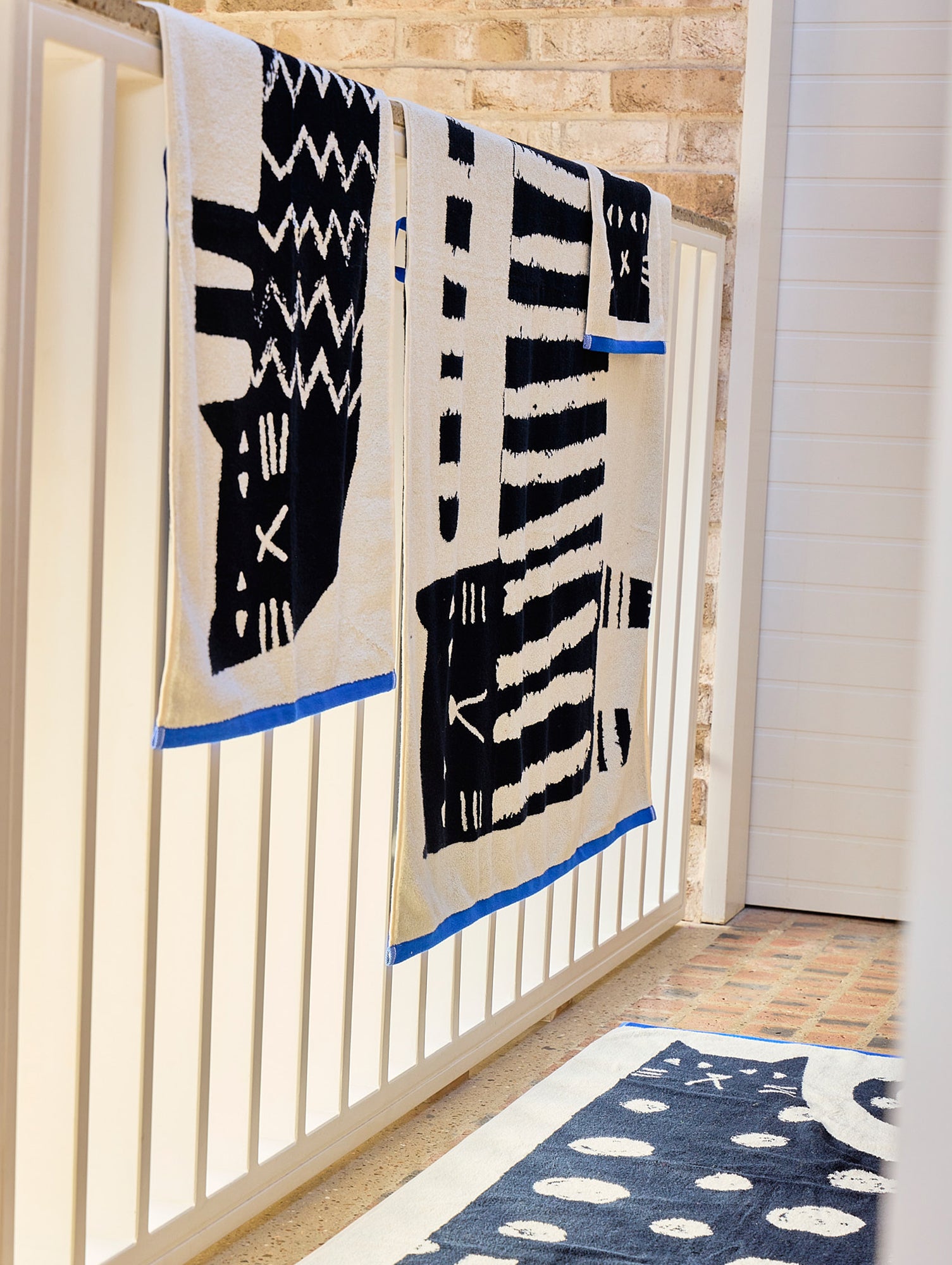 Lazy Cat Towels by Donna Wilson