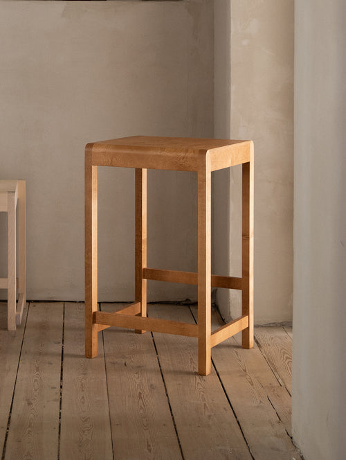 Simple wood outlet counter stool
