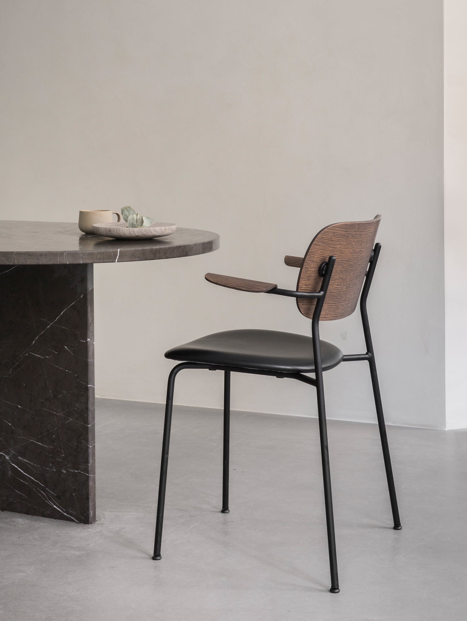 Co Dining Chair Upholstered by Menu - With Armrest / Black Powder Coated Steel / Dark Oak / Dakar Black Leather 